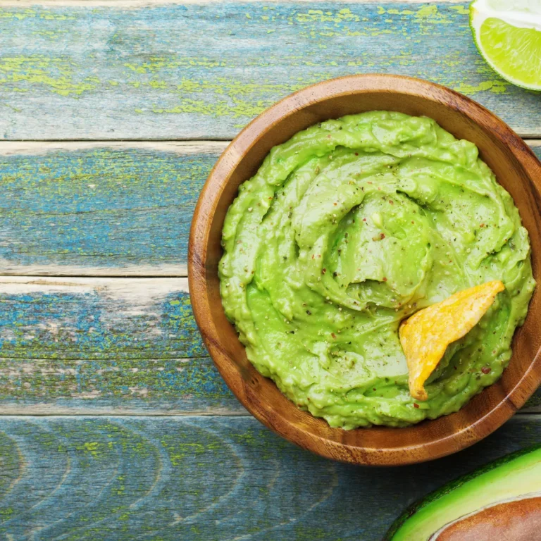 Guacamole in a wooden bowl — Concord Wholesale
